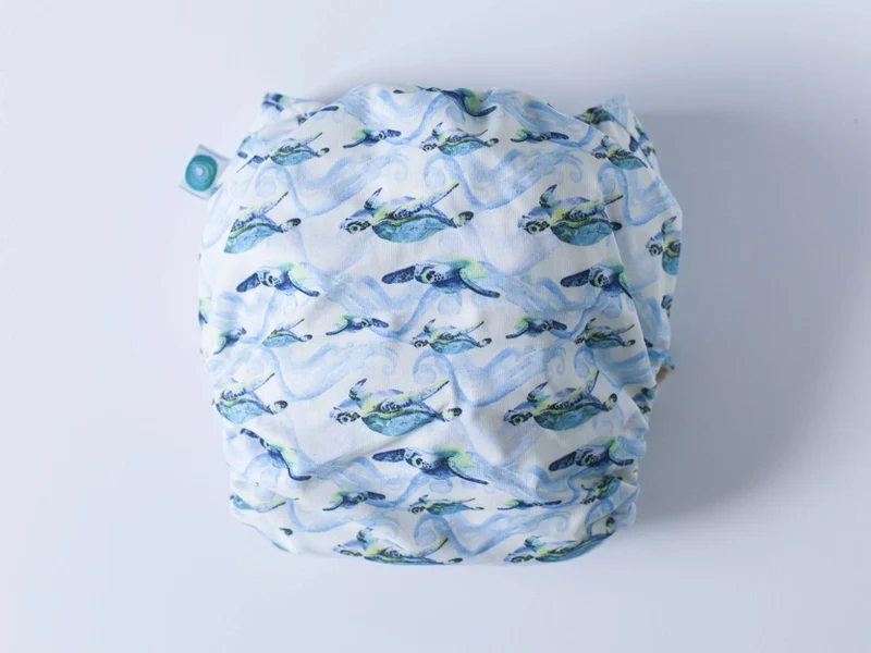 EcoTiny - pocket con tasca in cotone tartaruga